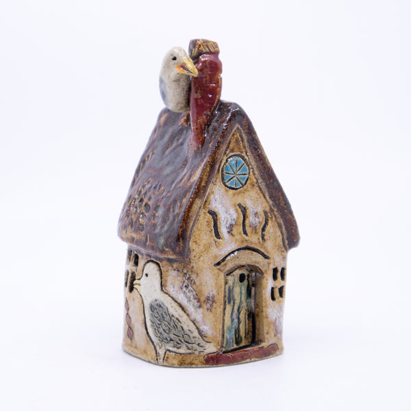 House – Round Seagull House (brown with porthole window)