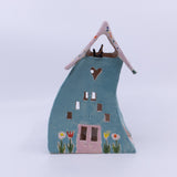 Turquoise House with the Freckled Roof