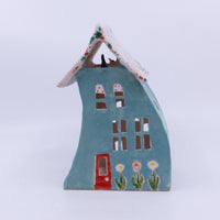 Turquoise House with the Freckled Roof